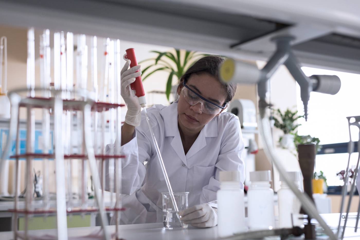 Scientist using a pipette in a lab