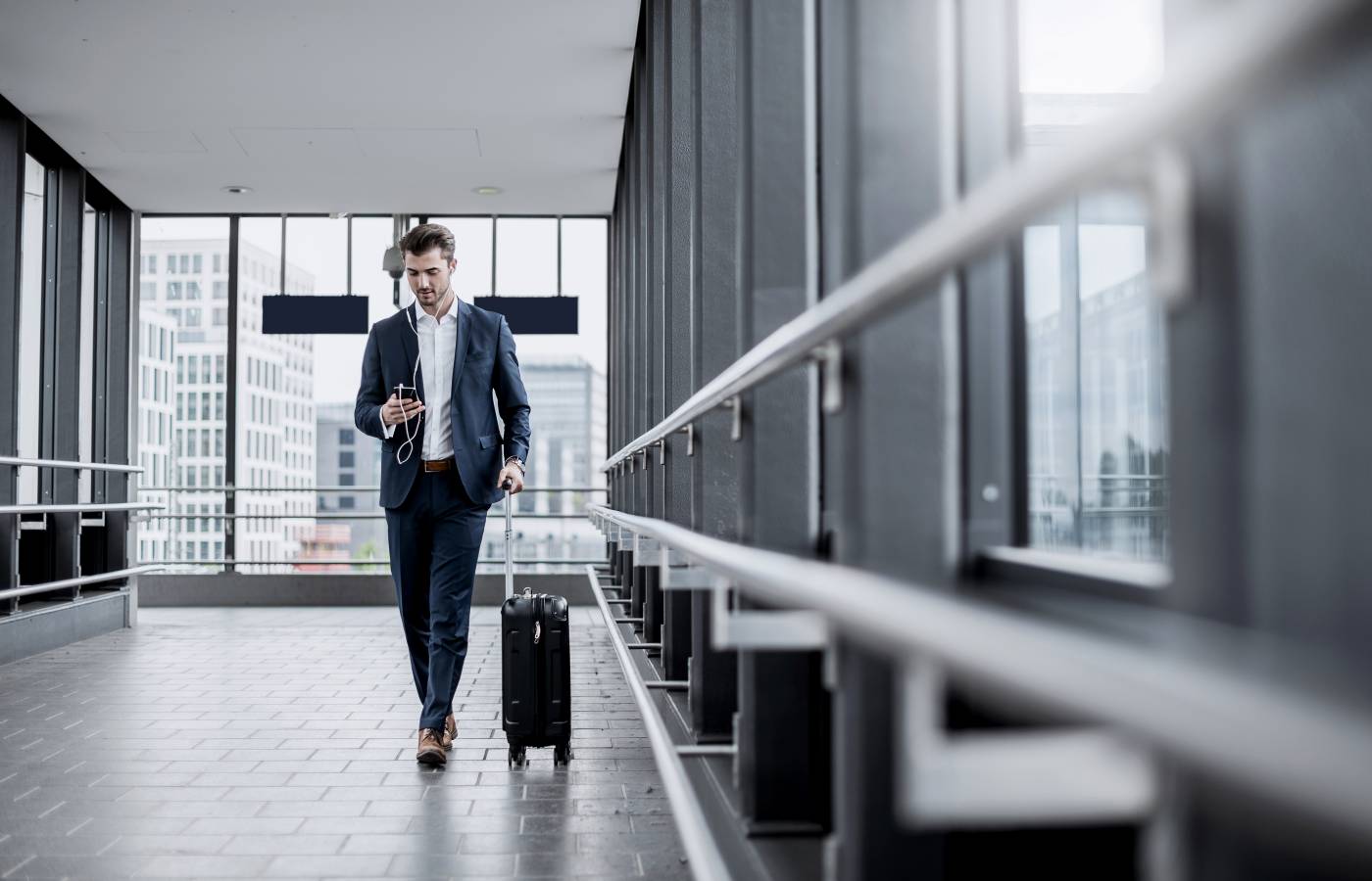 Business man walking with phone