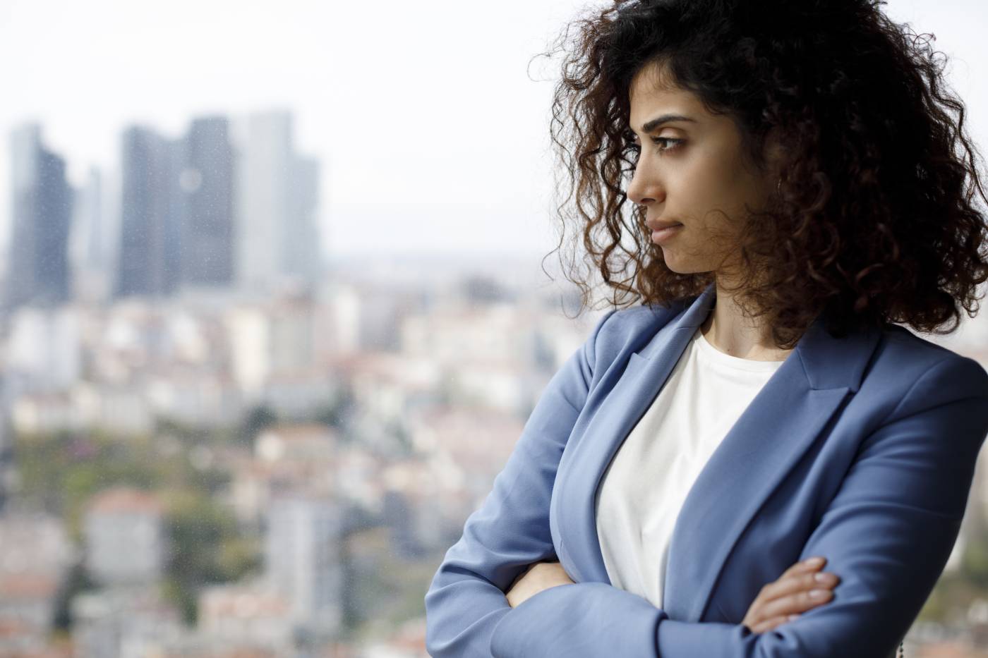 Professional woman thinking about the disadvantages of using Dropbox