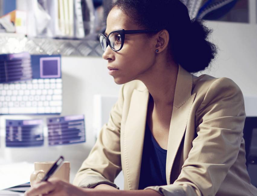 Businesswoman working on preparing her company's proxy statement with help from DFIN