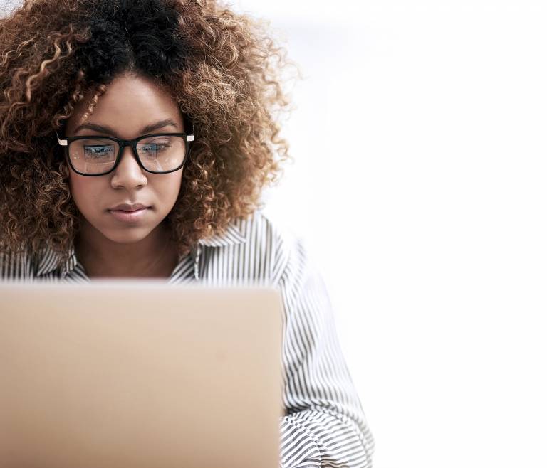 Businesswoman focused on laptop