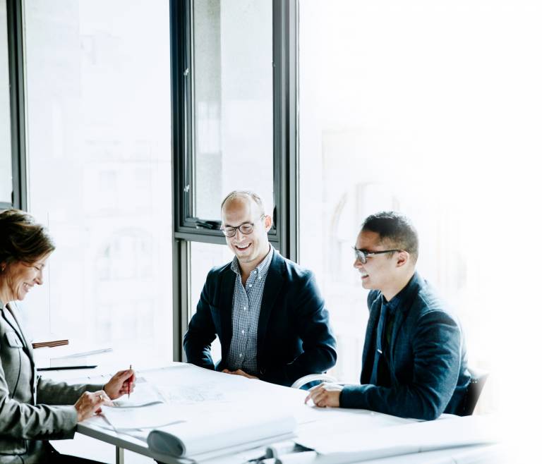 Businesspeople in a meeting about proxy content